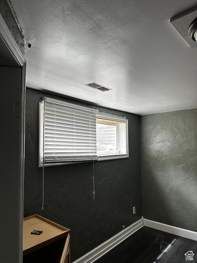 5160 S 200 E, Washington Terrace, UT 84405 - spare room featuring a textured ceiling, wood finished floors, a textured wall, and baseboards