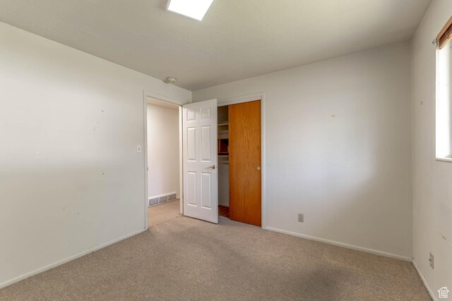 81 S 700 E, Bountiful, UT 84010 - unfurnished bedroom with baseboards, light colored carpet, visible vents, and a closet