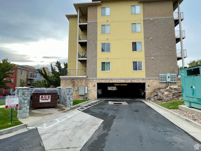 165 W Albion Village Way Unit 103, Sandy, UT 84070 - view of building exterior with an attached garage and driveway