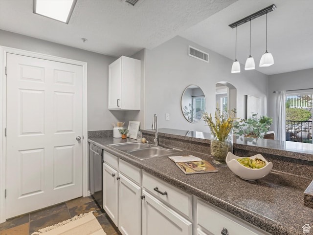165 W Albion Village Way Unit 103, Sandy, UT 84070 - kitchen featuring visible vents, stainless steel dishwasher, dark countertops, white cabinets, and a sink