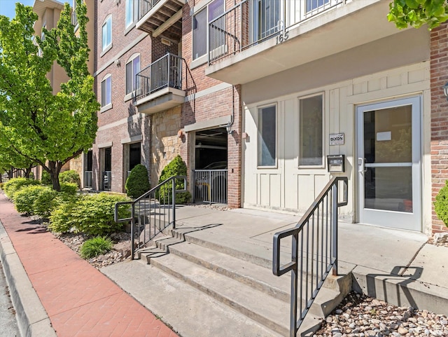 165 W Albion Village Way Unit 103, Sandy, UT 84070 - entrance to property featuring board and batten siding and brick siding