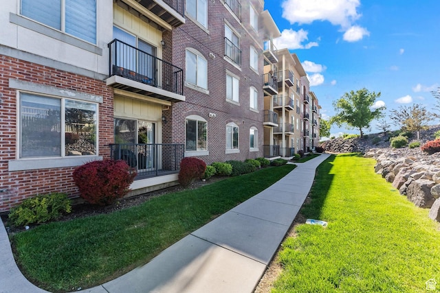 165 W Albion Village Way Unit 103, Sandy, UT 84070 - view of community with a lawn