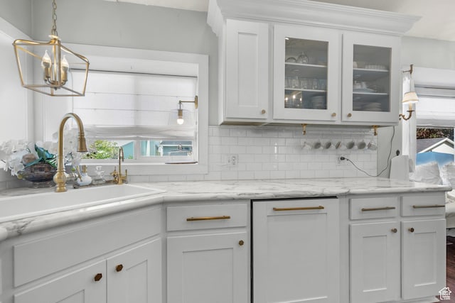 5472 W Aristada Ave S, West Jordan, UT 84081 - kitchen with white cabinetry, glass insert cabinets, a sink, and tasteful backsplash