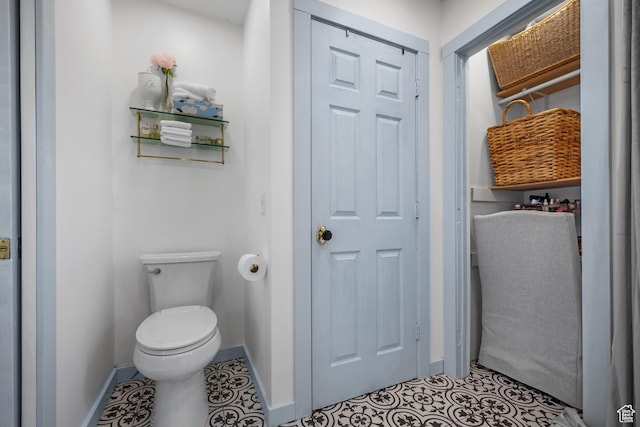 5472 W Aristada Ave S, West Jordan, UT 84081 - bathroom with baseboards, tile patterned flooring, and toilet