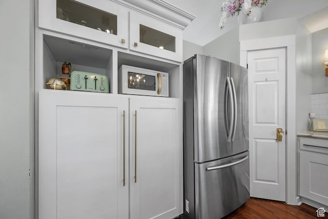 5472 W Aristada Ave S, West Jordan, UT 84081 - kitchen with freestanding refrigerator, dark wood finished floors, white microwave, and glass insert cabinets