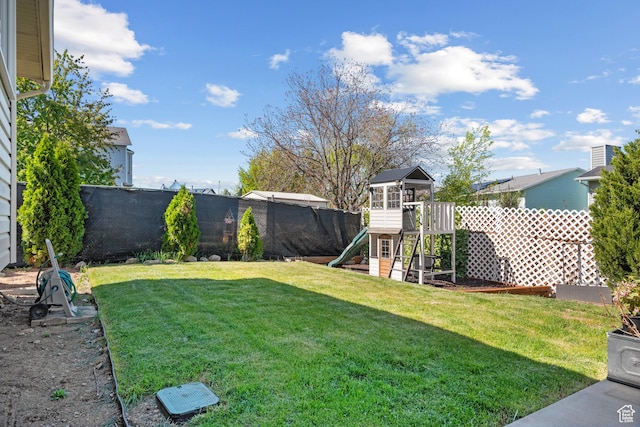 5472 W Aristada Ave S, West Jordan, UT 84081 - view of yard with a fenced backyard and a playground