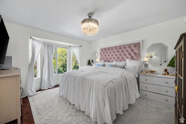 5472 W Aristada Ave S, West Jordan, UT 84081 - bedroom with an inviting chandelier and light wood-style floors