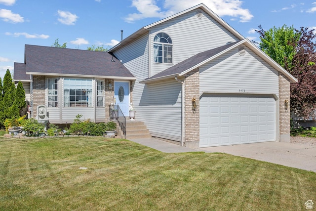 5472 W Aristada Ave S, West Jordan, UT 84081 - view of front of house with brick siding, driveway, and a front lawn