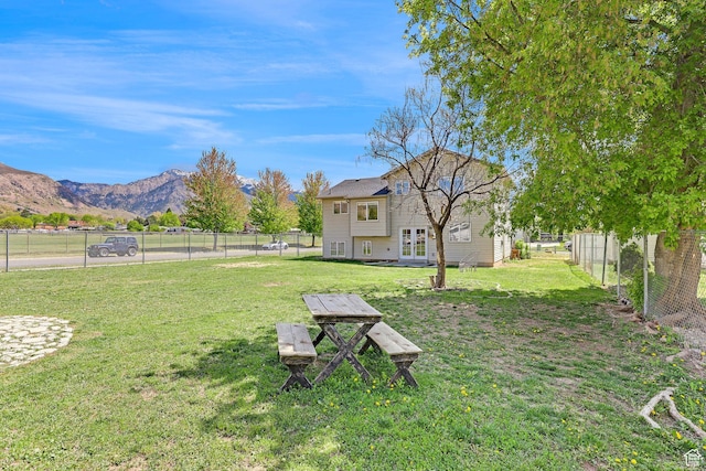 706 E 425 S, Ogden, UT 84404 - view of yard with french doors, a mountain view, and a fenced backyard