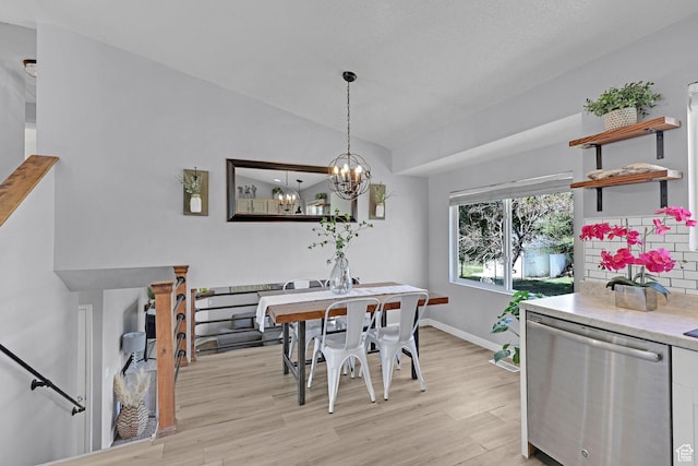 706 E 425 S, Ogden, UT 84404 - dining room featuring a chandelier, baseboards, vaulted ceiling, and light wood-style floors