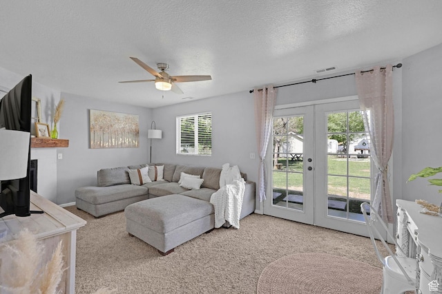 706 E 425 S, Ogden, UT 84404 - living area featuring ceiling fan, french doors, carpet flooring, and a textured ceiling