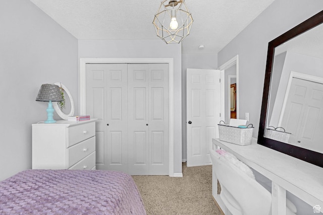 706 E 425 S, Ogden, UT 84404 - bedroom with a textured ceiling, light carpet, baseboards, and a closet