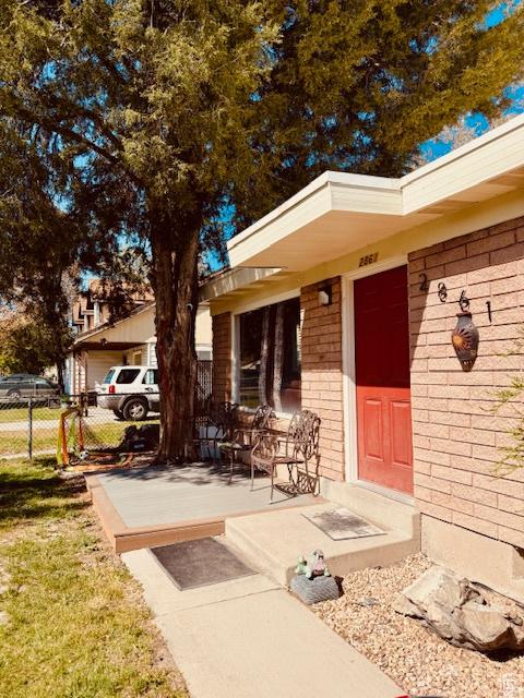 2861 S 3095 W, West Valley City, UT 84119 - property entrance featuring brick siding and fence