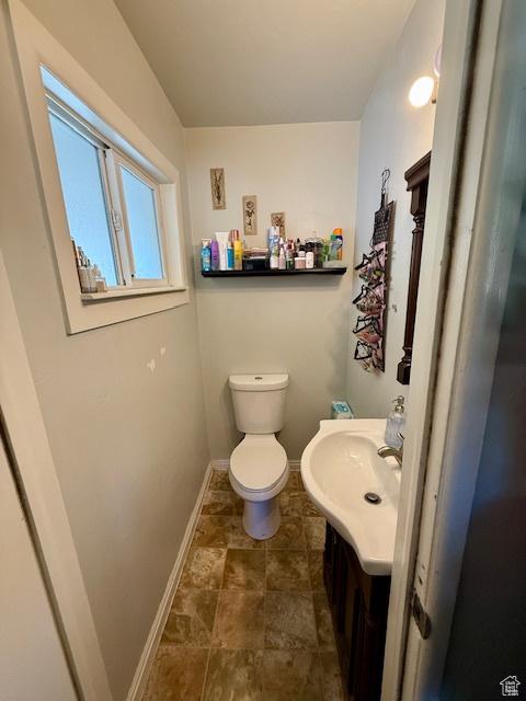 2861 S 3095 W, West Valley City, UT 84119 - half bath featuring baseboards, toilet, and vanity
