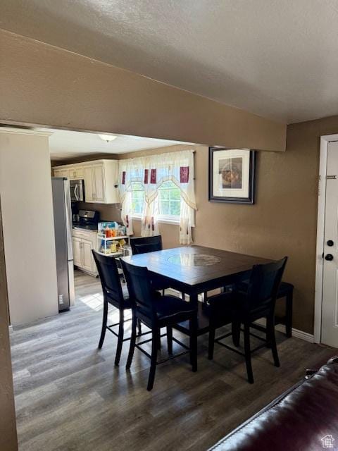 2861 S 3095 W, West Valley City, UT 84119 - dining room featuring a textured ceiling and light wood-type flooring