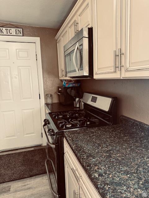 2861 S 3095 W, West Valley City, UT 84119 - kitchen featuring appliances with stainless steel finishes and dark stone countertops