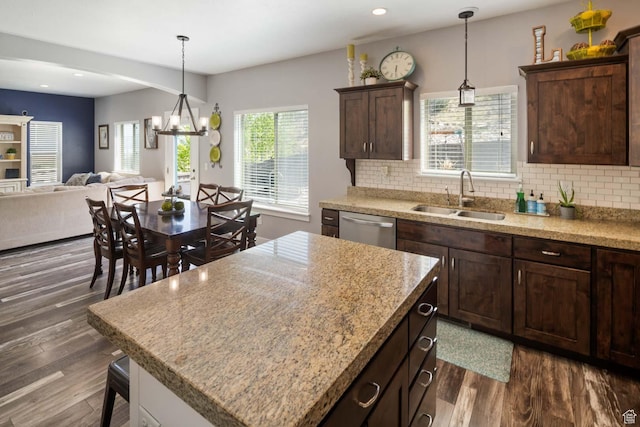 4126 E Cherokee, Eagle Mountain, UT 84005 - kitchen with dark brown cabinets, a sink, dishwasher, open floor plan, and dark wood-style floors