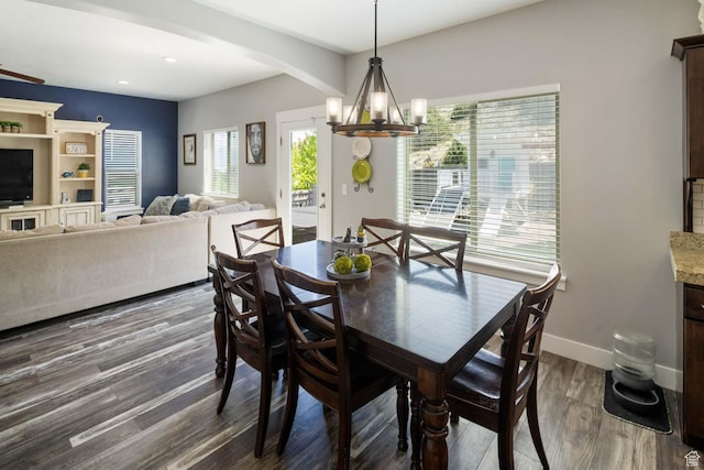 4126 E Cherokee, Eagle Mountain, UT 84005 - dining area featuring an inviting chandelier, dark wood-style flooring, baseboards, recessed lighting, and arched walkways