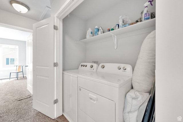 washroom with light carpet, laundry area, and washer and clothes dryer