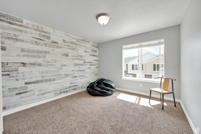 unfurnished room featuring baseboards and carpet flooring
