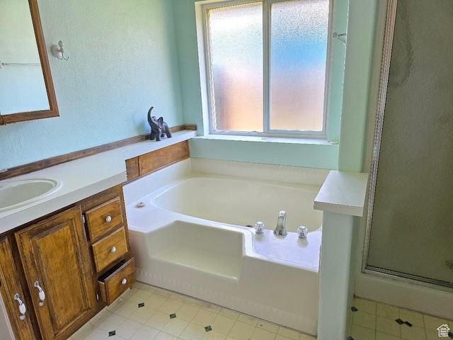 1177 W 1960 S, Logan, UT 84321 - full bathroom featuring tile patterned flooring, a shower stall, a bath, and vanity