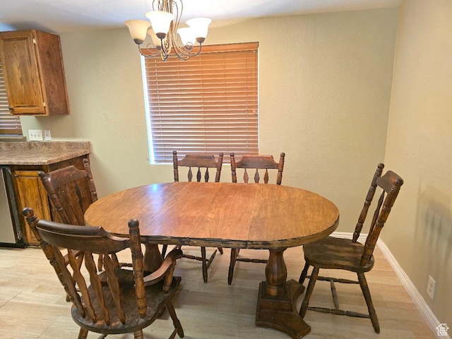 1177 W 1960 S, Logan, UT 84321 - dining space featuring an inviting chandelier, baseboards, and light wood-type flooring