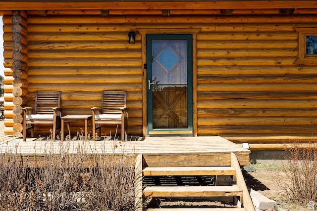 entrance to property with log siding