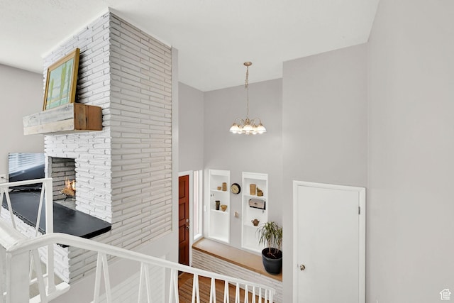 507 N 200 W, Brigham City, UT 84302 - interior space featuring an inviting chandelier, a high ceiling, and a fireplace