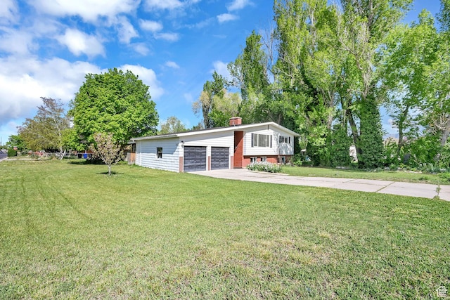 507 N 200 W, Brigham City, UT 84302 - view of front of property featuring a chimney, a front yard, and a garage