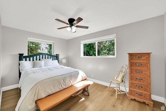507 N 200 W, Brigham City, UT 84302 - bedroom with a ceiling fan, baseboards, and light wood-style floors