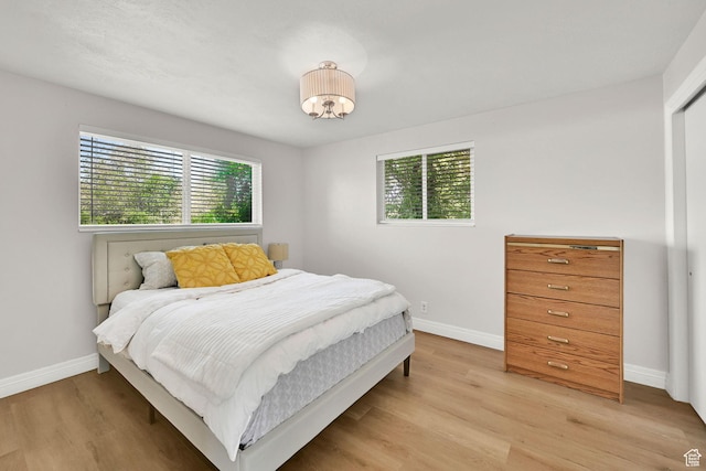 507 N 200 W, Brigham City, UT 84302 - bedroom with baseboards and light wood-style flooring