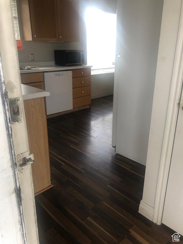 729 Timpie Rd, Tooele, UT 84074 - kitchen featuring light countertops, white dishwasher, and dark wood-style floors