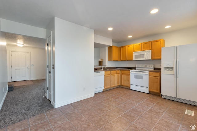 kitchen with dark countertops, white appliances, baseboards, recessed lighting, and light tile patterned floors