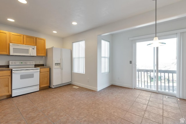 kitchen with recessed lighting, white appliances, light tile patterned flooring, and decorative light fixtures