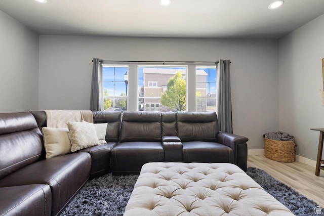 living area featuring recessed lighting, wood finished floors, and a wealth of natural light
