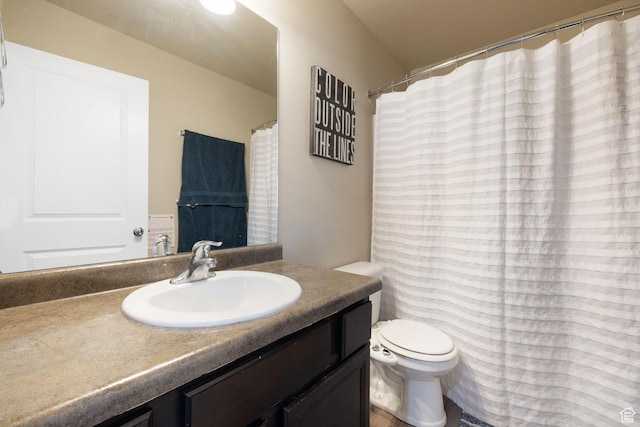 bathroom with toilet and vanity