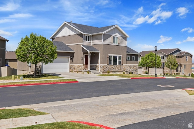 view of front of home featuring a residential view, a garage, concrete driveway, stone siding, and stucco siding