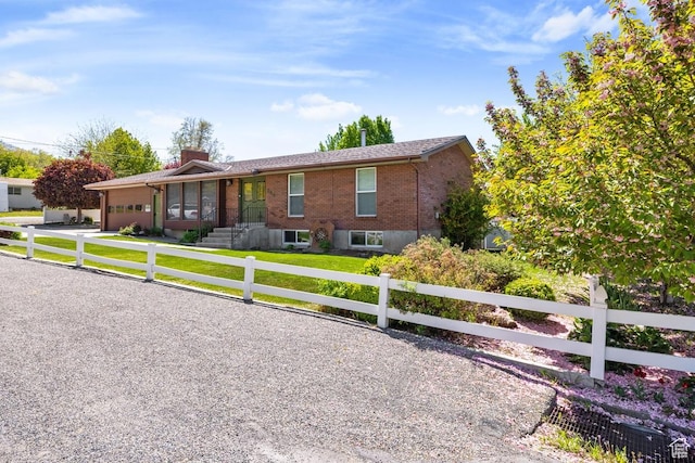 344 E 900 N, Pleasant Grove, UT 84062 - single story home with brick siding, a fenced front yard, a chimney, and a garage