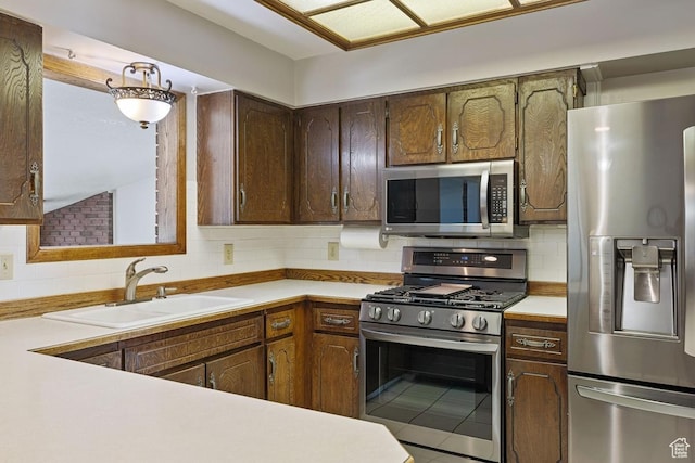344 E 900 N, Pleasant Grove, UT 84062 - kitchen with backsplash, stainless steel appliances, and light countertops
