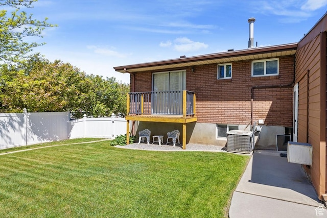 344 E 900 N, Pleasant Grove, UT 84062 - rear view of house with brick siding, a lawn, fence, and cooling unit