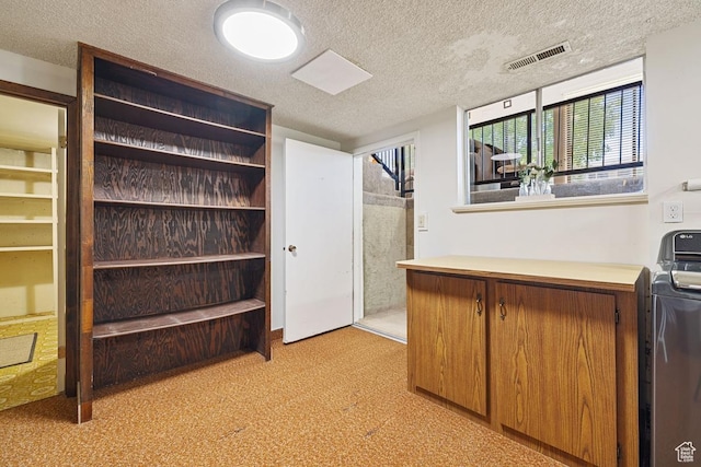 344 E 900 N, Pleasant Grove, UT 84062 - interior space with brown cabinets, light carpet, light countertops, a textured ceiling, and visible vents