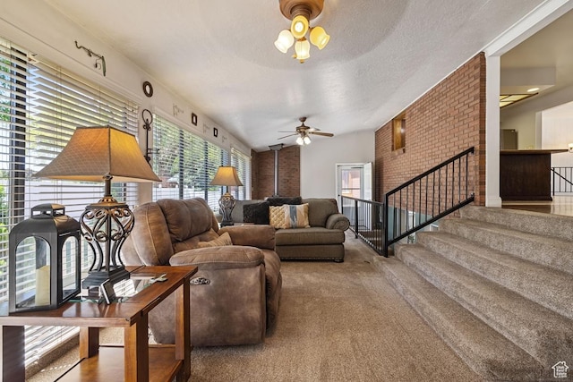344 E 900 N, Pleasant Grove, UT 84062 - carpeted living room featuring a textured ceiling, ceiling fan, vaulted ceiling, and stairway