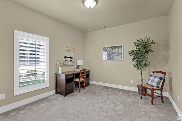 office featuring visible vents, carpet flooring, and baseboards