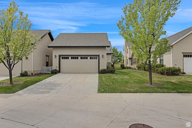 view of front of home with a garage, a front yard, stucco siding, a shingled roof, and driveway