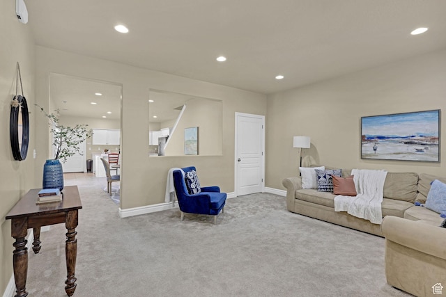 carpeted living room with baseboards and recessed lighting