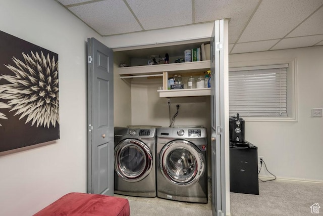 laundry room featuring laundry area, baseboards, carpet, and washing machine and dryer
