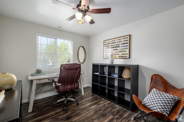 office space featuring a ceiling fan, baseboards, and wood finished floors