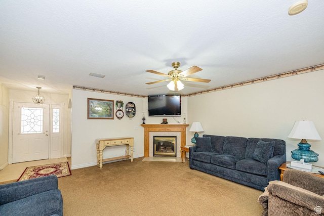 2983 W 2600 N, Plain City, UT 84404 - living room with light colored carpet, a ceiling fan, baseboards, a fireplace with flush hearth, and visible vents