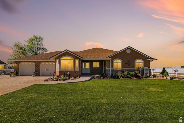 2983 W 2600 N, Plain City, UT 84404 - view of front of home featuring a garage, stucco siding, driveway, and a front yard