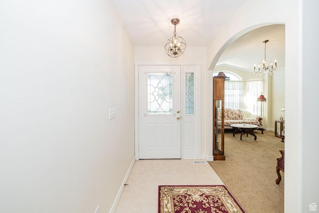 2983 W 2600 N, Plain City, UT 84404 - foyer featuring arched walkways, baseboards, a notable chandelier, and visible vents